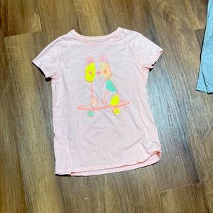 Pink top with skateboarding dog